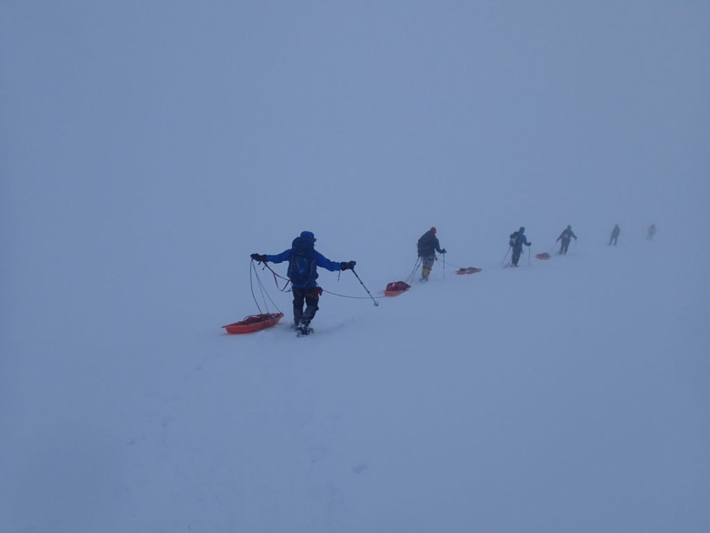 We practiced moving in rope teams with sleds in heavy snow.