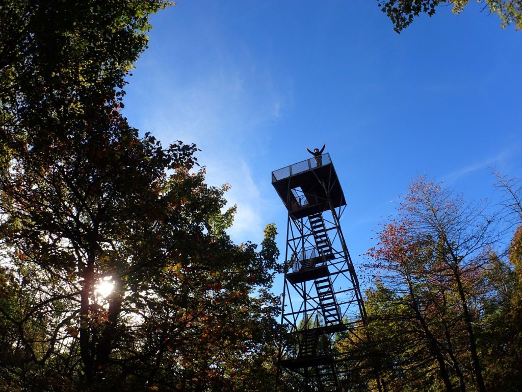 Danger on the summit tower with a brilliant blue backdrop of sky