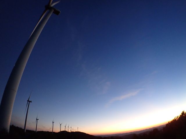 Windmills at sunset through wide angle lens