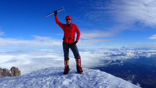 A very happy Danger stands on the summit of Mount Hood.