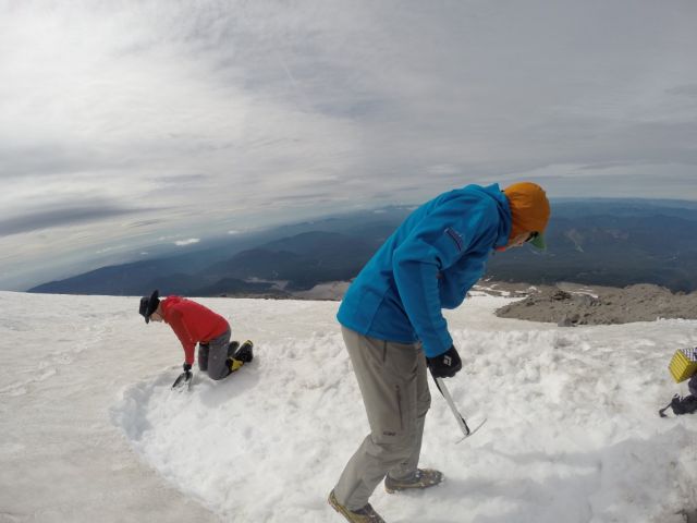 We worked quickly to dig out a level tent platform to beat the inbound rain clouds.